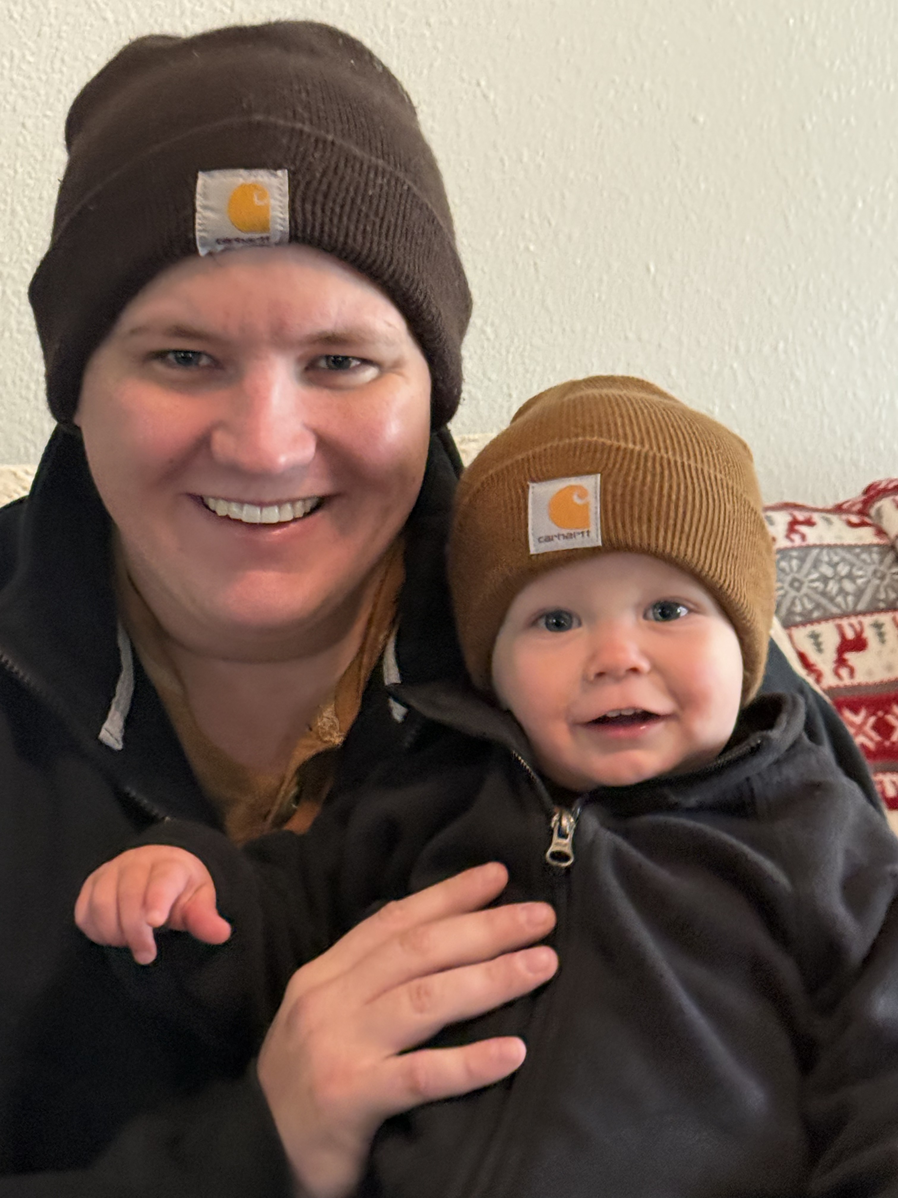 Jason David Newton with his son in winter hats in Moses Lake, Washington