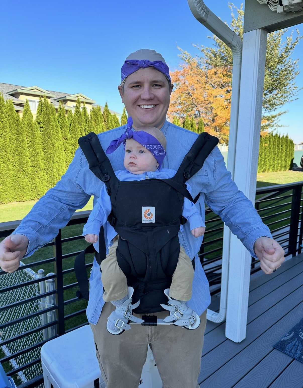 Jason David Newton and his son in matching baby carrier costume in Moses Lake, Washington