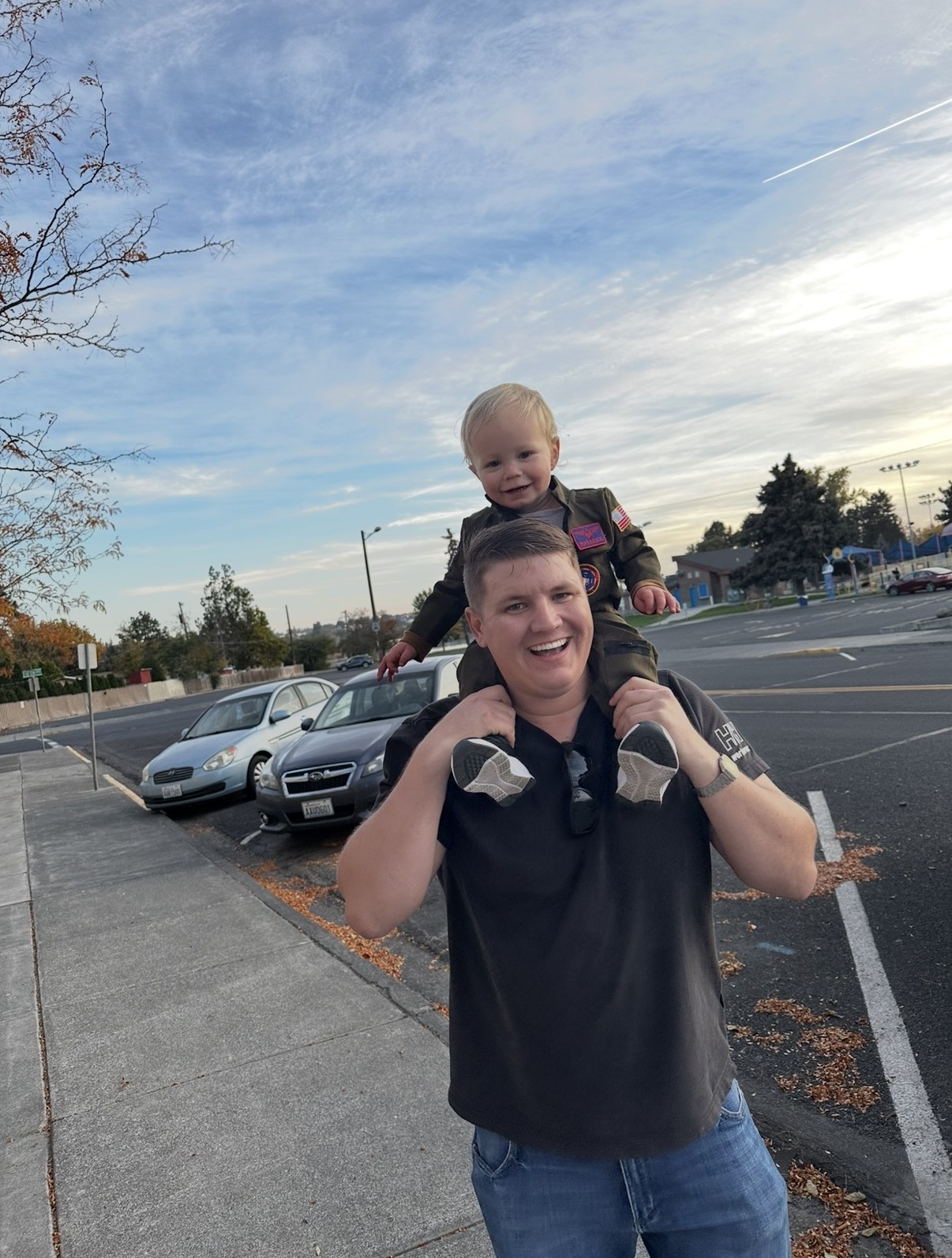 Jason David Newton with his son on shoulders at sunset in Moses Lake, Washington